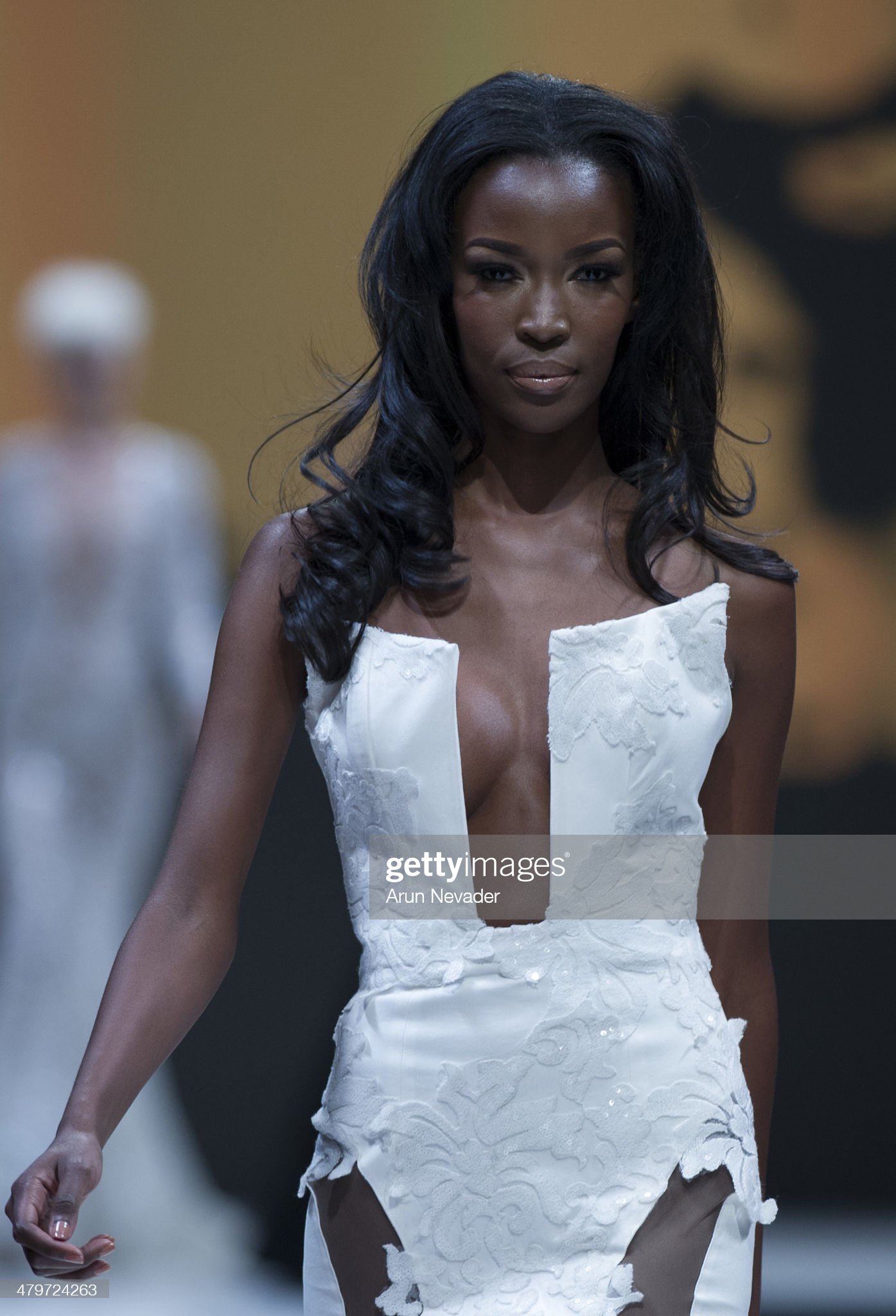 PALM DESERT, CA - MARCH 19:  Tia Shipman walks the runway for the Michael Costello Couture fashion show fall 2014 during Project Runway at El Paseo Fashion Week 2014 on March 19, 2014 in Palm Desert, California.  (Photo by Arun Nevader/WireImage)